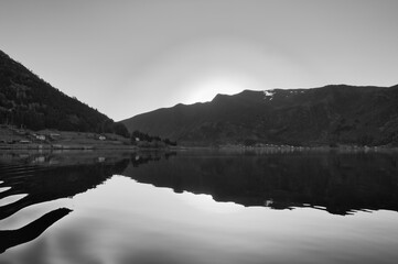 Norwegian fjord landscape. Mountains with rugged vegetation in black and white