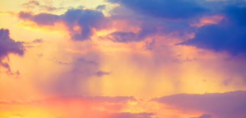 Colorful cloudy sky at sunset. Sky texture. Abstract nature background. Horizontal banner