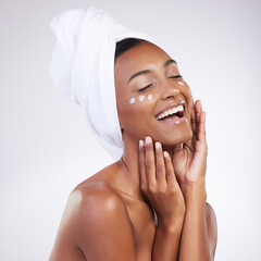 Woman, cream and happy for skincare with routine in studio on white background and satisfied with...