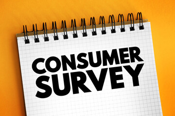 Fototapeta premium Consumer Survey is a source to obtain information about consumer satisfaction levels with existing products, text concept on notepad