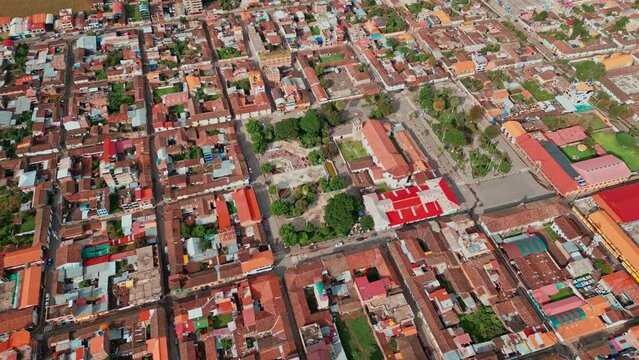 Enjoy a unique panoramic view of Calca Sacred Valley from the sky. Be enchanted by the majesty of the main church, its square and park, surrounded by the characteristic Red Earth mud roofs