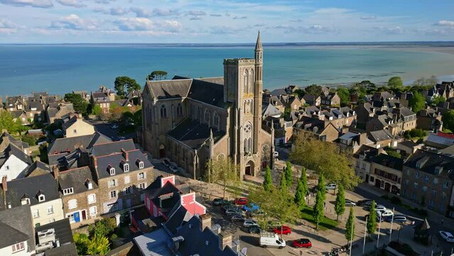 Saint-Meen church with sea in background, Cancale, Brittany in France. Aerial drone view