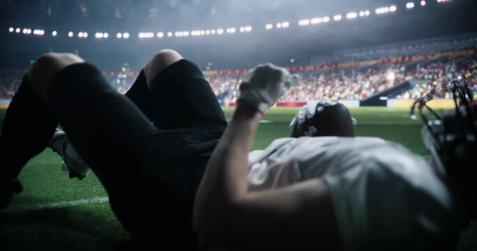 Football Player Running Towards the Endzone During a Championship Game in a Packed Stadium. The Athlete is Focused on Scoring a Touchdown as the Crowd Cheers in the Background