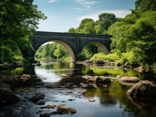 Fototapeta premium Serene Riverside View with Ancient Stone Bridge