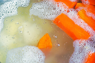 soup boils with carrots, potatoes, herbs and eggs. National food