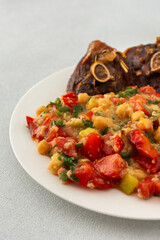 Delicious hearty lunch or dinner, chickpea stew with stewed vegetables, roasted turkey and hummus, healthy delicious food