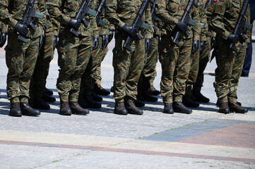 soldiers in uniform with rifle