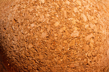 Macro photography. Yoga natural brown cork texture massage ball background. Closeup shot.