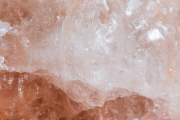 Himalayan salt texture, macro, copy space. Natural salt background. Himalayan coral pink rock salt, closeup.