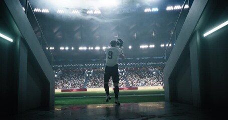 Caucasian American Football Player Walking Through a Dark Tunnel to a Big Outdoors Stadium Filled with Energetic Sports Fans and Team Supporters. Footballer Appreciating Support Before a Match