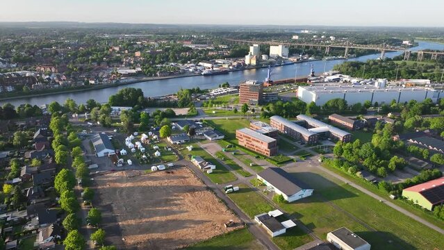 Aerial footage of Rendsburg and its surroundings on the Kiel Canal, featuring the Rendsburg High Bridge railway viaduct, Schleswig-Holstein, Germany.