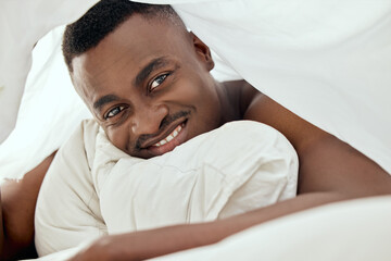 Portrait, smile and black man in bedroom to relax for peace, calm and healthy morning energy in...