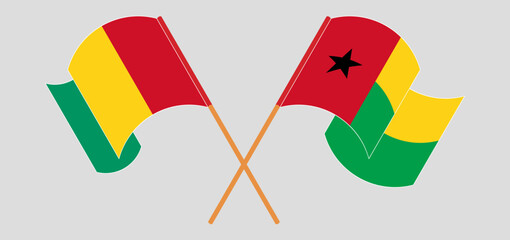 Crossed and waving flags of Guinea-Bissau and Guinea