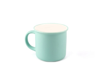 Empty green mint color mug for coffee or tea isolated on white background. Use for home or restaurant, food design. Concept kitchen utensils and tableware..