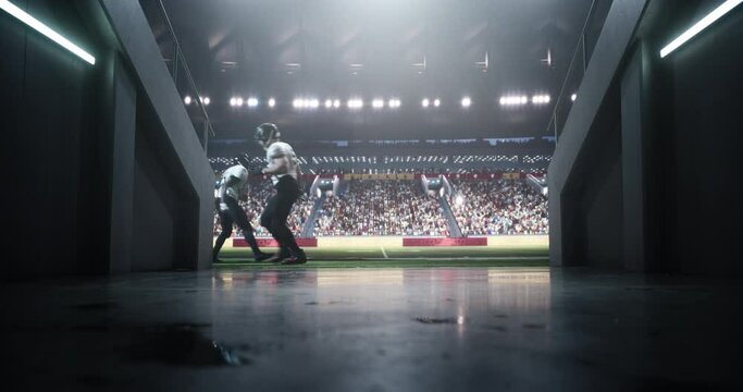 Footage Through a Tunnel Entrance to a Big Outdoors Stadium with Multiethnic American Football Players Running Back and Forth, Warming Up Before a Match. Stadium Filled with Energetic Sports Fans