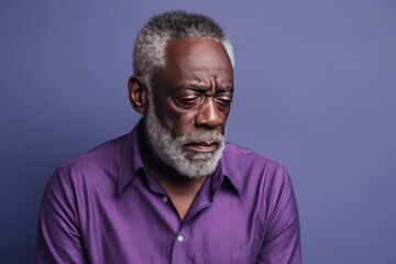 Lavender background sad black American independent powerful man. Portrait of older mid-aged person beautiful bad mood expression isolated on background racism 