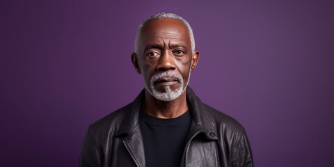 Purple background sad black American independent powerful man. Portrait of older mid-aged person beautiful bad mood expression isolated on background racism
