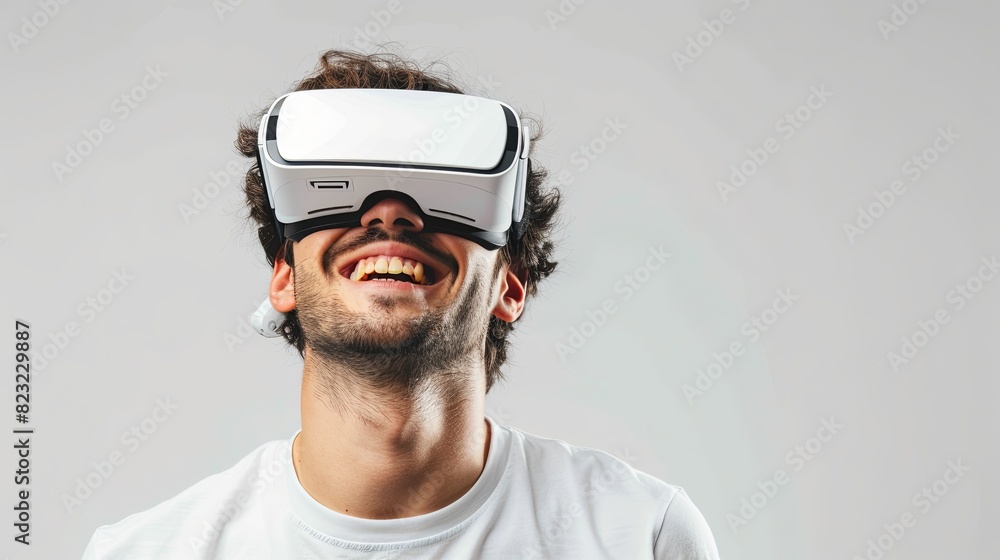 Aufkleber a man in a white t-shirt smiles while wearing virtual reality glasses in front of a plain white back