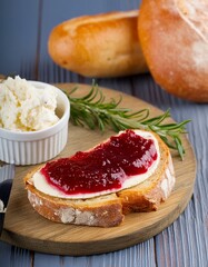 Piece of delicious cheeses and bread with curd cheese with jam