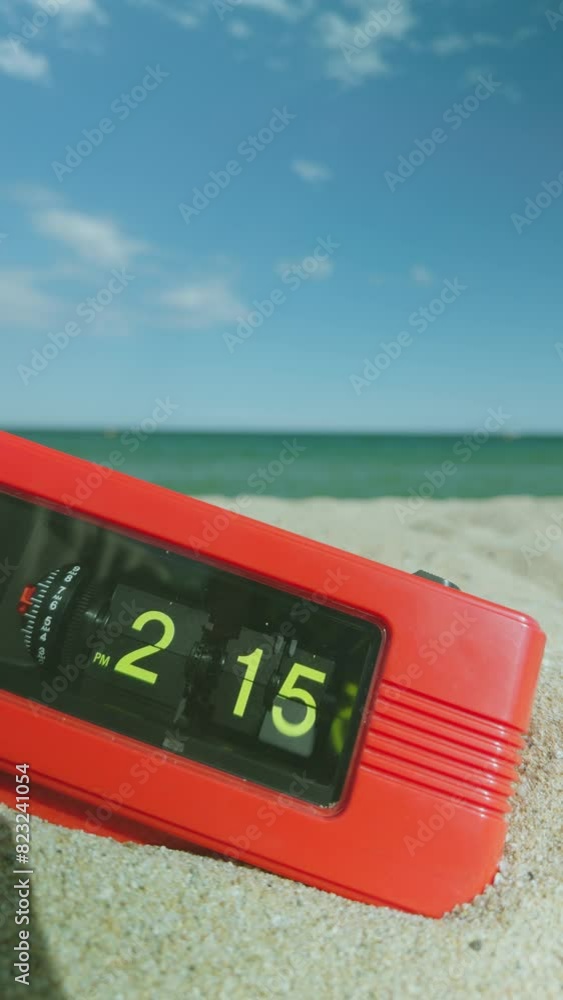 Aufkleber flip clock with time passing on a beach with sky and sea in vertical