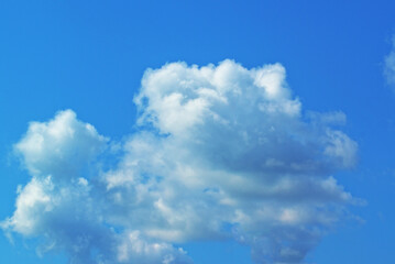 White cloud against a blue sky.