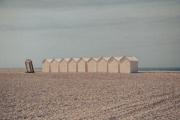 beach cabins on a  French pebble beach in Normandy in France