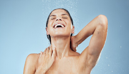 Happy, woman and shower water in blue background for skincare, wellness and hygiene with eyes...