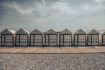 beach huts on a  French pebble beach in Normandy in France