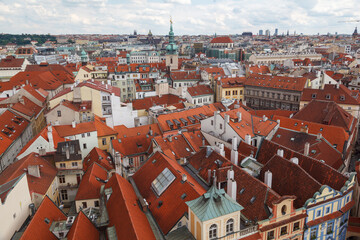 Obraz premium Aerial view of the rooftops of the historical buildings in Prague, Czech Republic