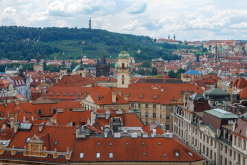 Obraz premium Aerial view of the rooftops of the historical buildings in Prague, Czech Republic