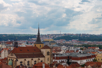 Fototapeta premium Aerial view of the rooftops of the historical buildings in Prague, Czech Republic
