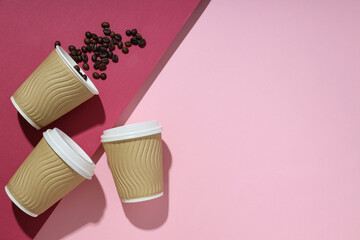Craft cups for coffee on a pink background