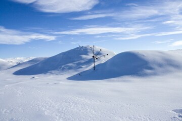 Winter scene with snow-covered mountainous terrain