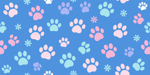 Seamless pattern with colorful paw prints and flowers on a blue background, perfect for pet-themed designs and products