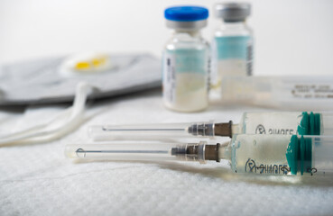 syringes with medicine on a white background