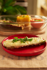 Zucchini stuffed with cheese and spices