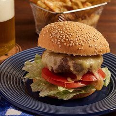 Homemade burger served with fries