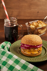 Homemade burger served with fries