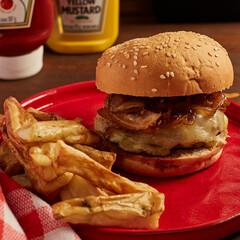 Homemade burger served with fries