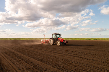 Tractor and seeder for sowing corn