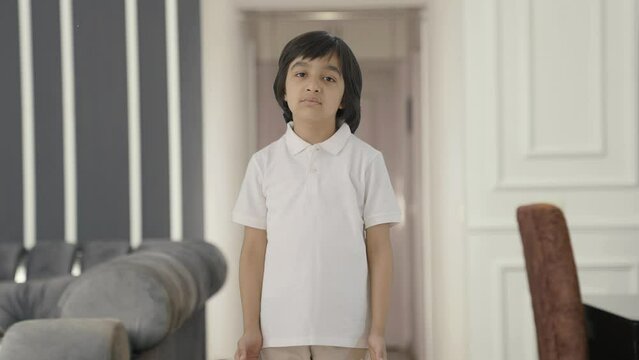 Indian boy asking what to the camera