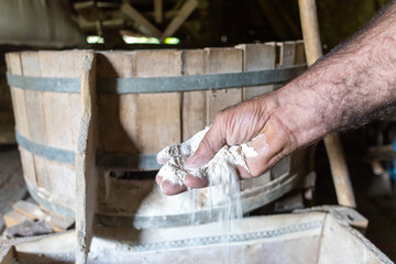 wholegrain flower being milled with watermill