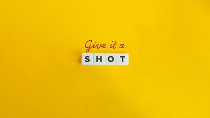 Give It a Shot Idiom. Text on Block Letter Tiles and Icon on Flat Background. Minimalist Aesthetics.