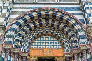 Details at facade of Genoa Cathedral or Metropolitan Cathedral of Saint Lawrence in Genoa, Italy.