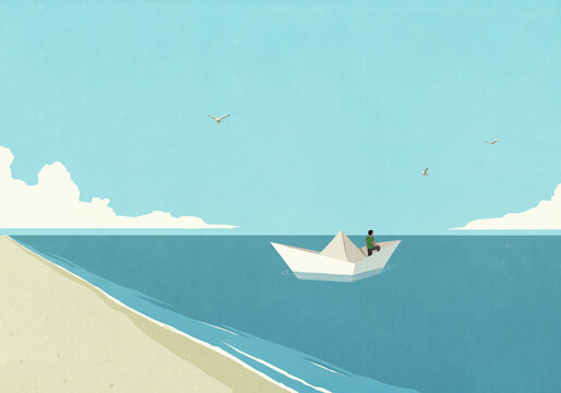 Man floating in paper boat on blue ocean, embarking on journey
