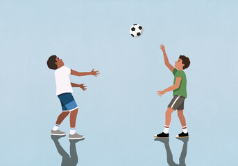 Boy friends playing with soccer ball on blue background
