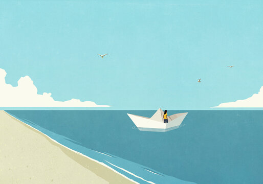 Woman floating in paper boat on blue ocean
