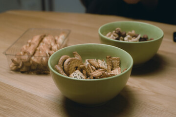 a few bowls that are on top of a table covered with cereal