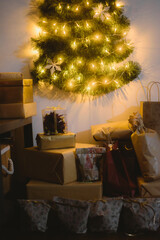 several presents under a christmas tree with the lights on and many presents underneath