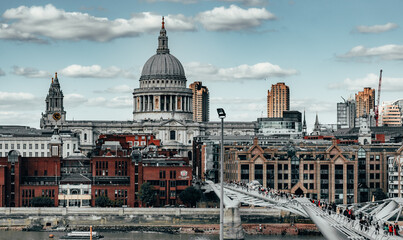 Fototapeta premium Busy city bridge scene with a crowd of pedestrians, London, UK